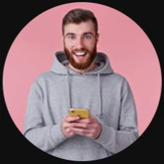 Man smiling at his phone